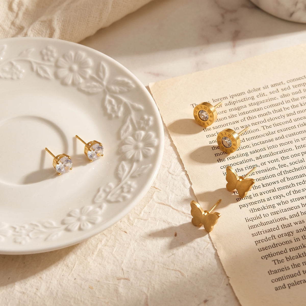 QIAOREN 14465 3 Pair  Gold Stainless Steel Stud Earrings Set, Round Prong CZ, Roman Numeral Disc & Textured Butterfly Studs