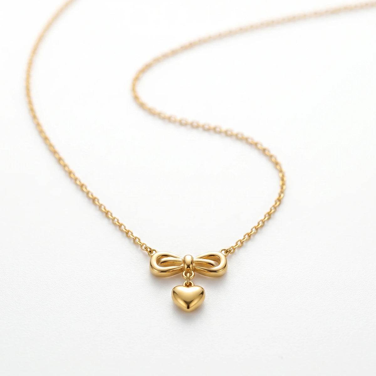QIAOREN 13499 Coquette Style Bow Drop Heart Pendant Necklace, Dainty Thin Oval Cable Chain Gold Neck Jewelry Gift