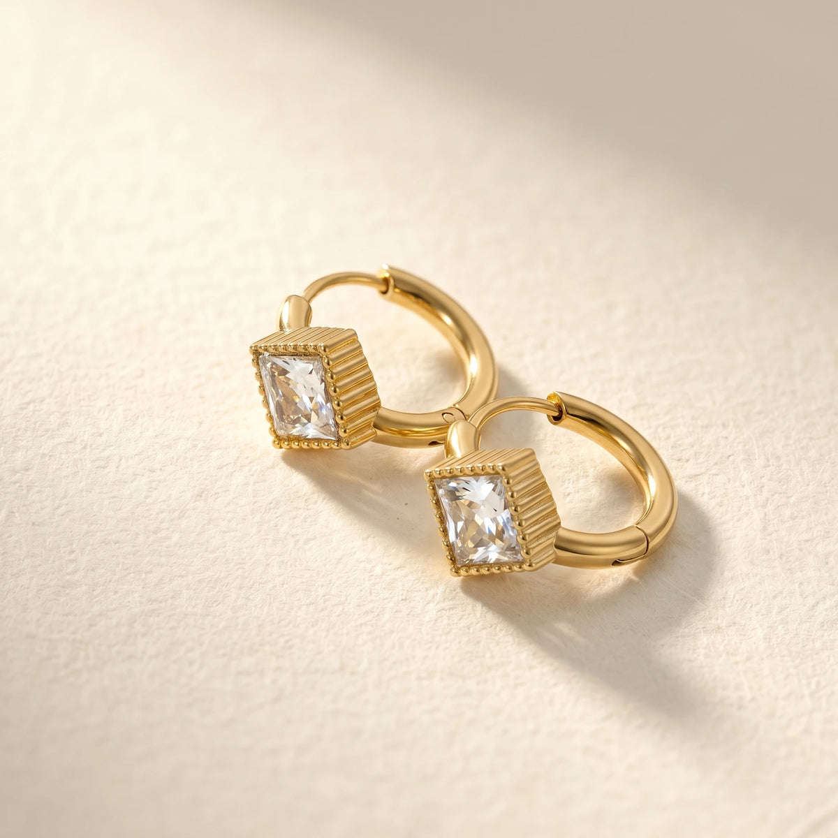 QIAOREN 12121-24 18K Gold Plated Stainless Steel Huggie Hoop Earrings Princess Cut Square CZ Inlaid Textured Bezel Ear Buckle