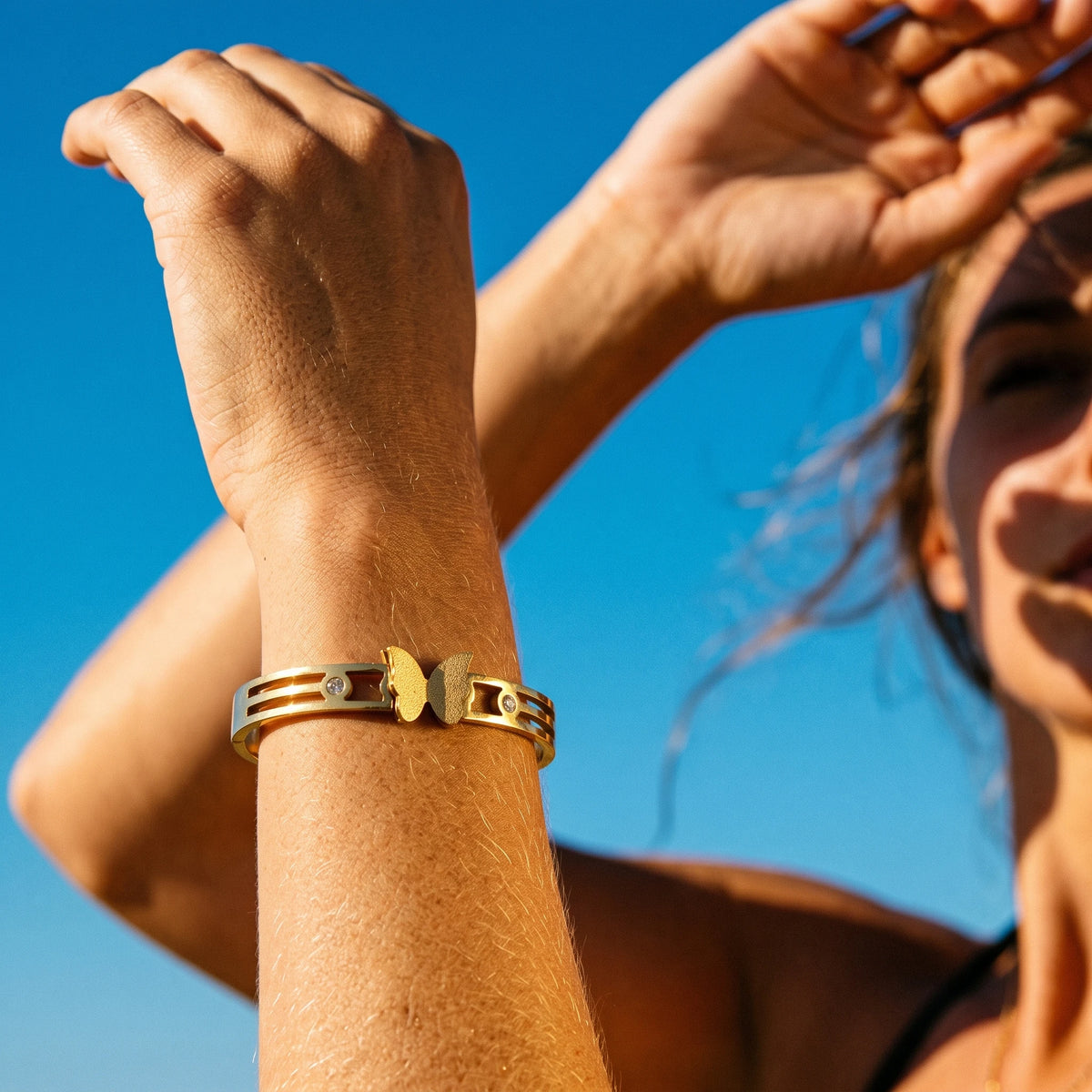 QIAOREN 13651 Hollow Triple Bar Spring Cuff Bangle with Matte Butterfly & Tiny Round Zircon Dual Charms, Open Gold Bangle