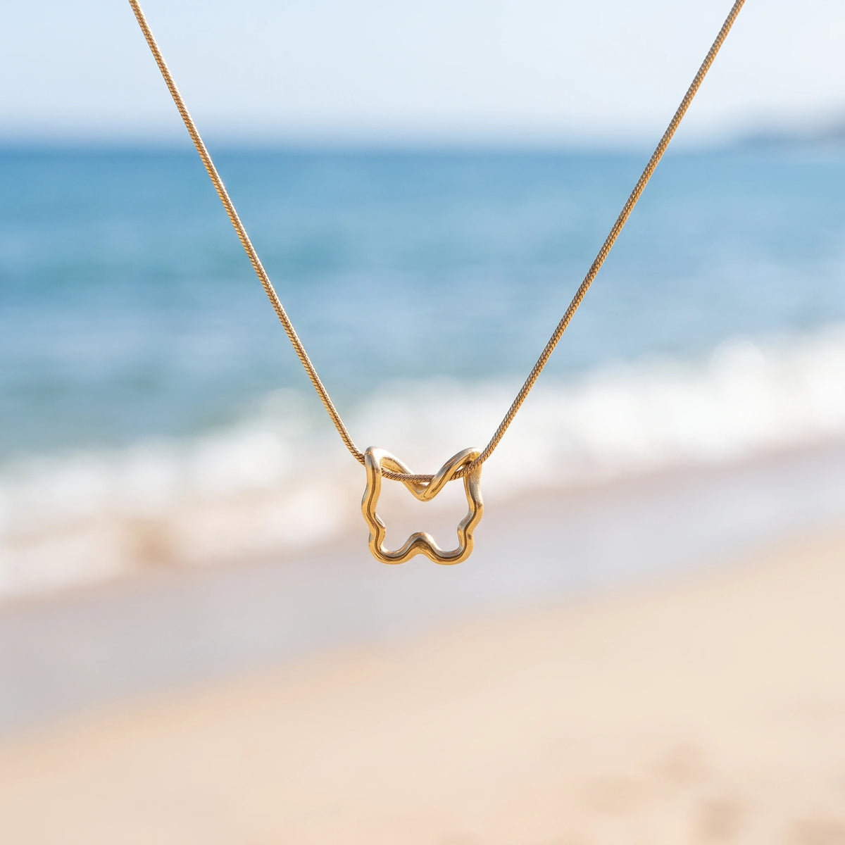 QIAOREN 13802 Thin Snake Chain Hollow Outline Butterfly Pendant Necklace with Beaded Border Texture Frame, Polished Matte Gold